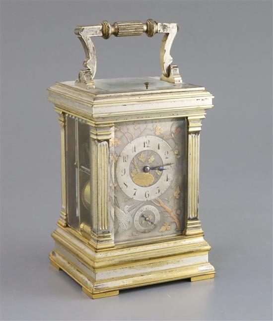 An early 20th century French silvered and parcel gilt hour repeating carriage alarum clock, 7in.